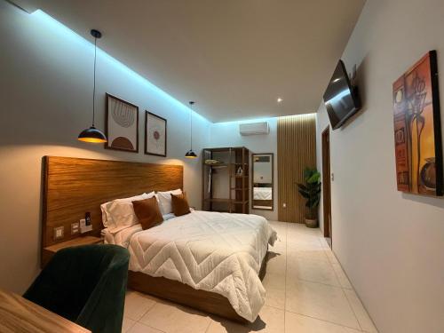 a bedroom with a bed and a blue light at Casa Bocobá in Oaxaca City