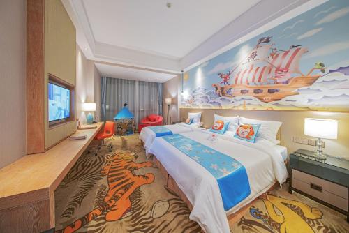 a hotel room with a large bed and a mural at Best Boutique Hotel in Nanhui