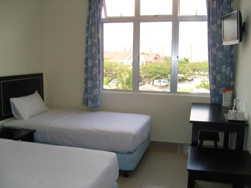 Postel nebo postele na pokoji v ubytování Hotel Orient