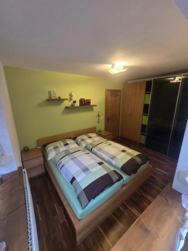 a bedroom with a large bed in a room at Herzensplatzl in Pfaffenhofen