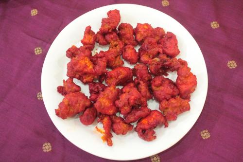a white plate of food on a purple table at Chettinaadu Narayana Vilas in Kānādukāttān