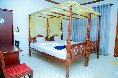 Кровать или кровати в номере Gayana Guest House