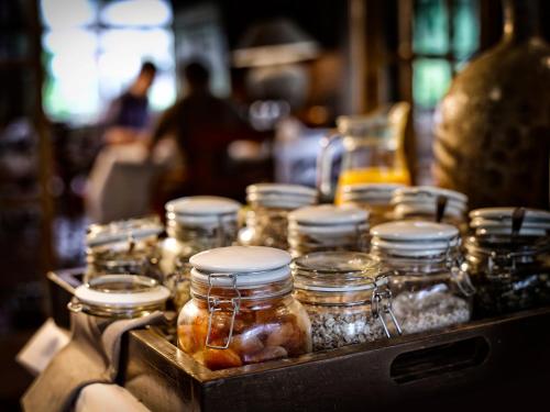 a bunch of jars of food sitting on a table at Landgoed De Holtweijde in Lattrop