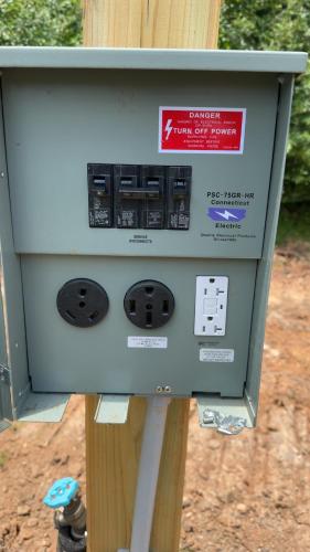 a parking meter with a sign on top of it at RV Sites at Off the Road Oasis in Lufkin