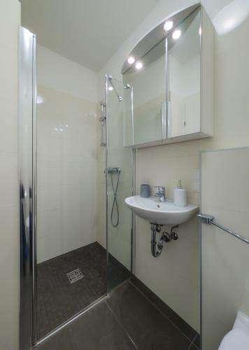 a bathroom with a shower and a sink at Haus CKPK Lux in Sonnenalpe Nassfeld