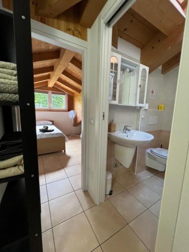 a bathroom with a toilet and a sink at Casa da Matti in Gravedona