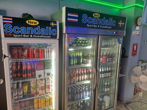 two refrigerators in a store with soda and sodas at Scandalic Bar and Guest house in Pattaya