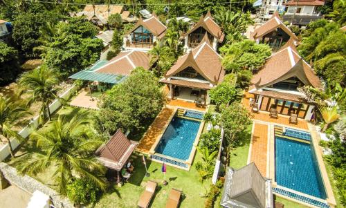an aerial view of a house with a swimming pool at Amazing Beachfront Villa in Ko Lanta