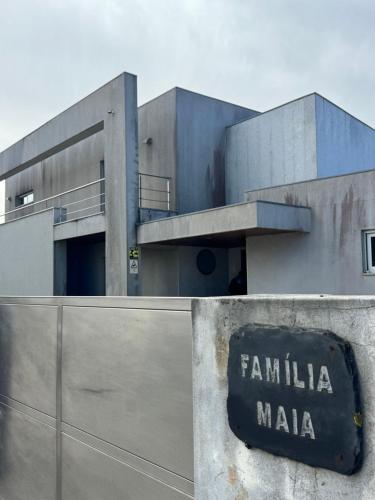 a building with a sign that says familia mala at Luxurious Seaside Suite - Garden - Ping Pong Table - near Porto in Lavra