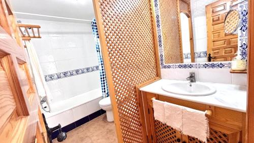 a bathroom with a sink and a toilet and a shower at Vitamin Sea in Zahara de los Atunes