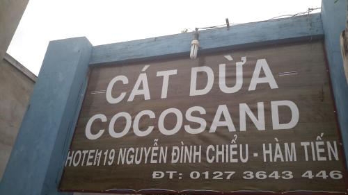 a sign for a cat dumeococacist on a building at Cocosand Hotel in Mui Ne