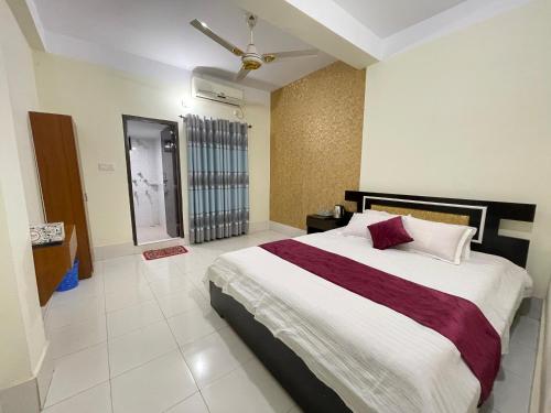 a bedroom with a large bed in a room at Sky n Valley in Bāndarban