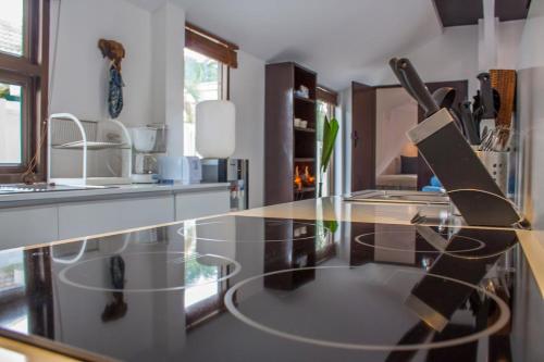 a kitchen with a glass counter top with a knife at Southern Lanta C9 in Ko Lanta