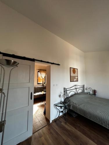 a bedroom with a bed and a dresser in it at Kuca Mir Seaside Apartments - 50m from Beach in Ugljan