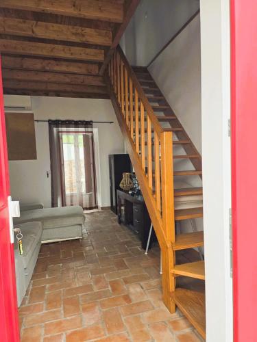 a staircase in a room with a living room at Casa Pedra da Foz in Odeceixe