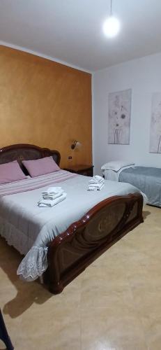 a bedroom with a large bed with a tub on it at Lampedusa da Sogno 1 in Lampedusa
