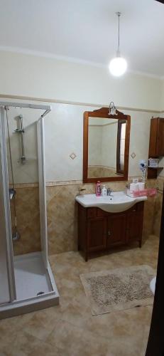 a bathroom with a sink and a mirror at Lampedusa da Sogno 1 in Lampedusa
