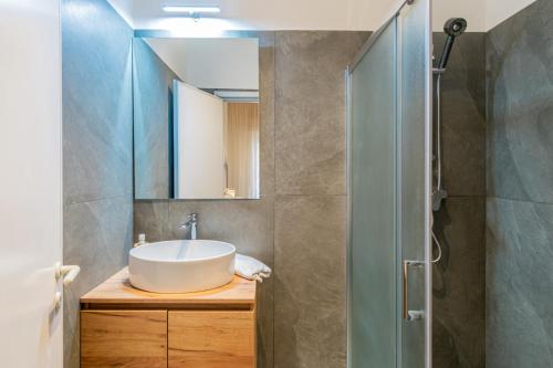 a bathroom with a sink and a mirror at Hotel Cavalluccio Marino in Gabicce Mare