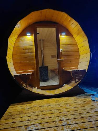 a roundorthole view of a sauna in a wooden cabin at Domek w górach Lachowice in Lachowice