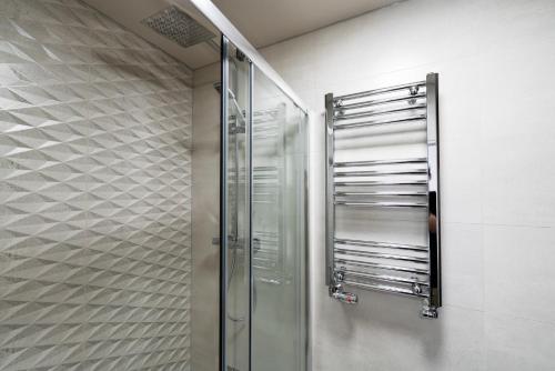 a shower with a glass door in a bathroom at Apex Studios by Derbnb in Derby