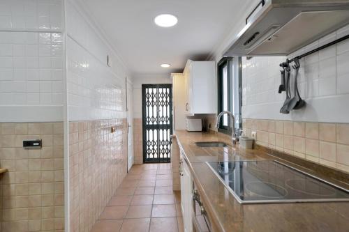 a kitchen with a sink and a counter top at Casa Mar & Golf in San Luis de Sabinillas
