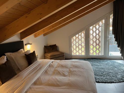 a bedroom with a large bed and a large window at Sogno La Vigna - Adults Only in Montegrosso dʼAsti