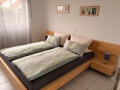 two beds sitting next to each other in a bedroom at Urlaub im fränkischen Seenland in Bergen