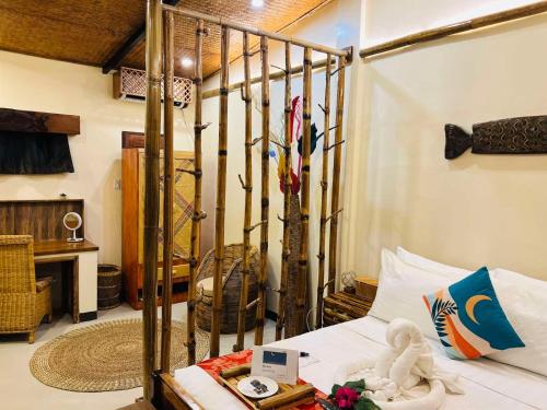 a bedroom with a bed in a room at La Colonial Resort - Wellness Access Included in El Nido