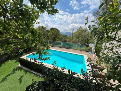 a swimming pool in the yard of a house at Cabaninhas House by Gerês Casas in Terras de Bouro