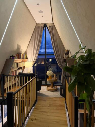 a room with a staircase with a view of the ocean at Widok Paleśnica in Paleśnica