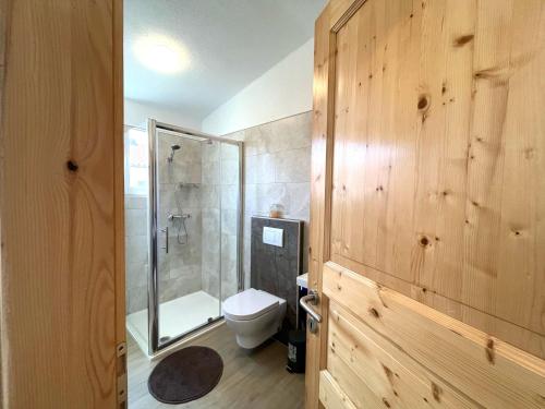 a bathroom with a shower and a toilet and a shower at Apartmani Drago in Vir