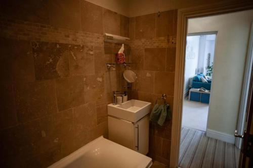 a bathroom with a toilet and a sink at Sea View Ultimate Boutique escape! in Barnstaple