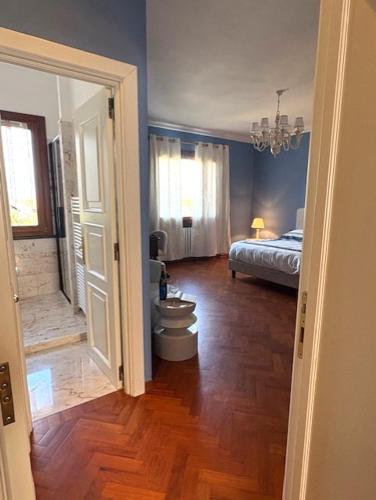 a room with a bedroom with a bed and a toilet at CuordiSole Tuscany in Montopoli in Val dʼArno