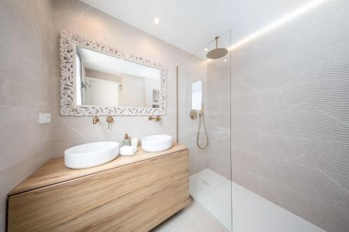 a bathroom with a sink and a mirror and a shower at Luxury Beachfront "Felicità" Sea View 6 Guests in Arenales del Sol