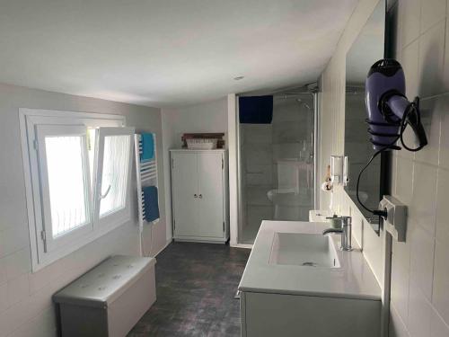a small bathroom with a sink and a toilet at T2 cyclamen independent in Cholet