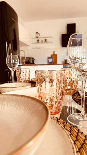 a table with wine glasses on top of it at House Jelka - Apartment Nina in Supetar