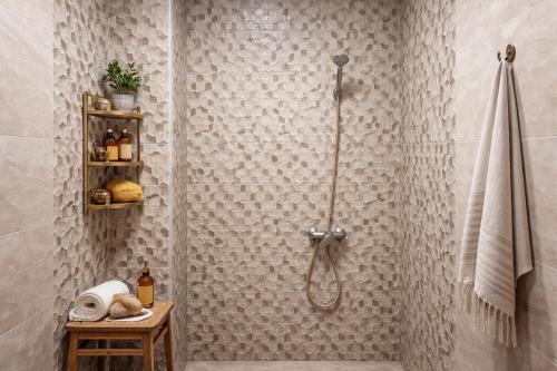 a bathroom with a shower with a shower curtain at Appartement moderne à 5 min de la plage de Mehdia Vacances idéales 2026 in Mehdiya-Plage
