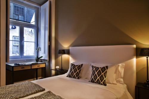 Ένα ή περισσότερα κρεβάτια σε δωμάτιο στο Lisbon Five Stars Apartments São Paulo 55