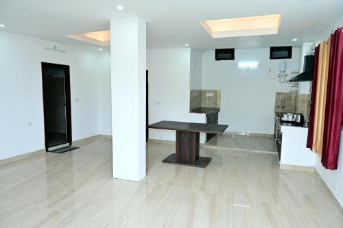 a room with a wooden table in the middle at Shanti Residency Ramgarh in Rāmgarh