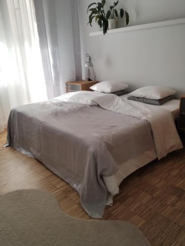a bedroom with two beds and a window at MIKO apartament in Mikołów