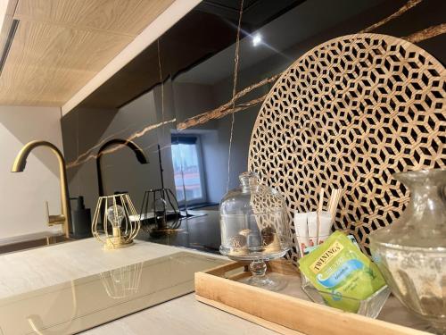 a kitchen with a counter top with a sink at Le Cocon du Mont'Anay in Montanay