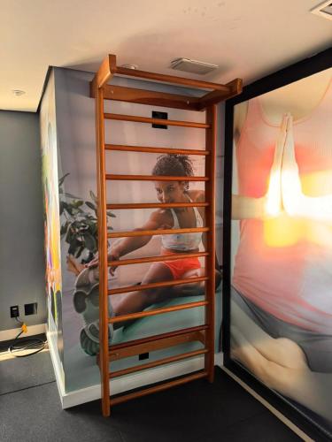 a sliding glass door with a picture of a child at MN Gotado Hotel Flat Guarulhos Aeroporto in Guarulhos