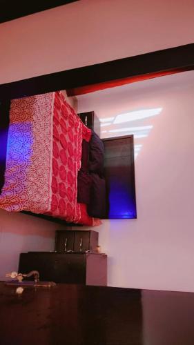 a room with two beds on a wall at Taj Plaza in Sowayma