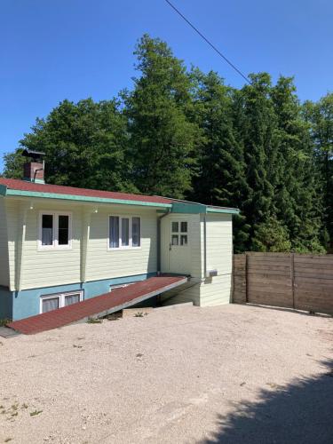 a house with a garage and a fence at Waldchalet in Burgthann