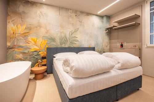 a bedroom with a bed and a bath tub and a bathroom at Agriturismo La Ratta in Vernasca