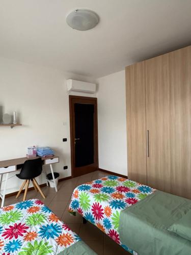 a bedroom with a bed and a desk and a desk at Bed &... Fly in Grassobbio