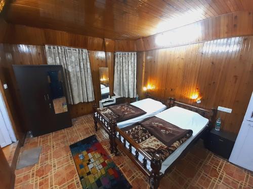 an overhead view of a bedroom with two beds at Himalayan Heritage Stay in Darjeeling
