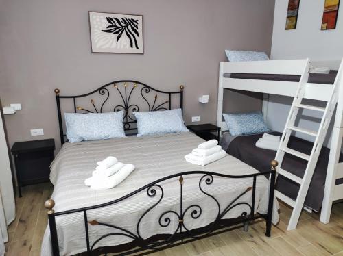 a bedroom with a bed and a bunk bed at 50 Special in Pontedera