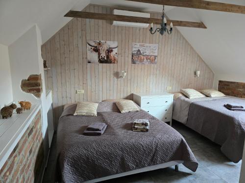 a bedroom with two beds in a room at Prostě statek in Skalka