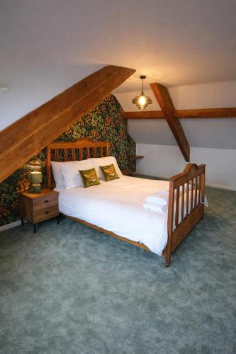 a bedroom with a large bed in a attic at Cambois beach Maisonette with sea view! in Cambois